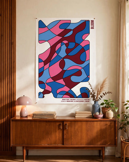 Bloom A2 poster displayed above a wooden sideboard in a warm Scandinavian-style interior