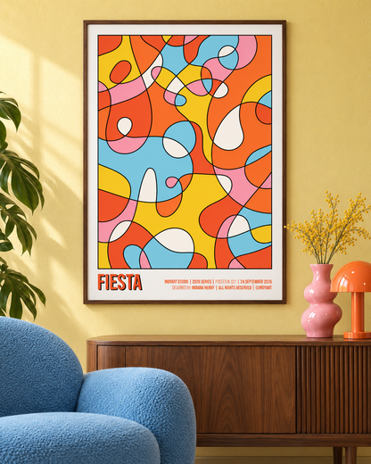 Fiesta colorful abstract A2 poster styled on a yellow wall above a walnut sideboard with a blue chair and pink vase.